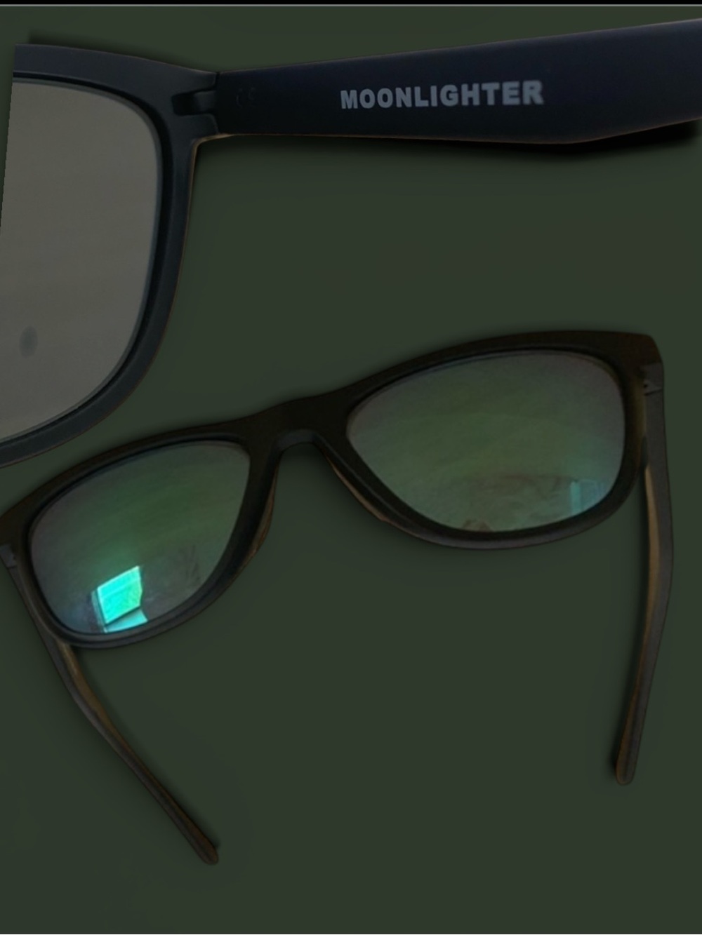 Oakley Black Sunglasses with Green-Reflective Lenses
